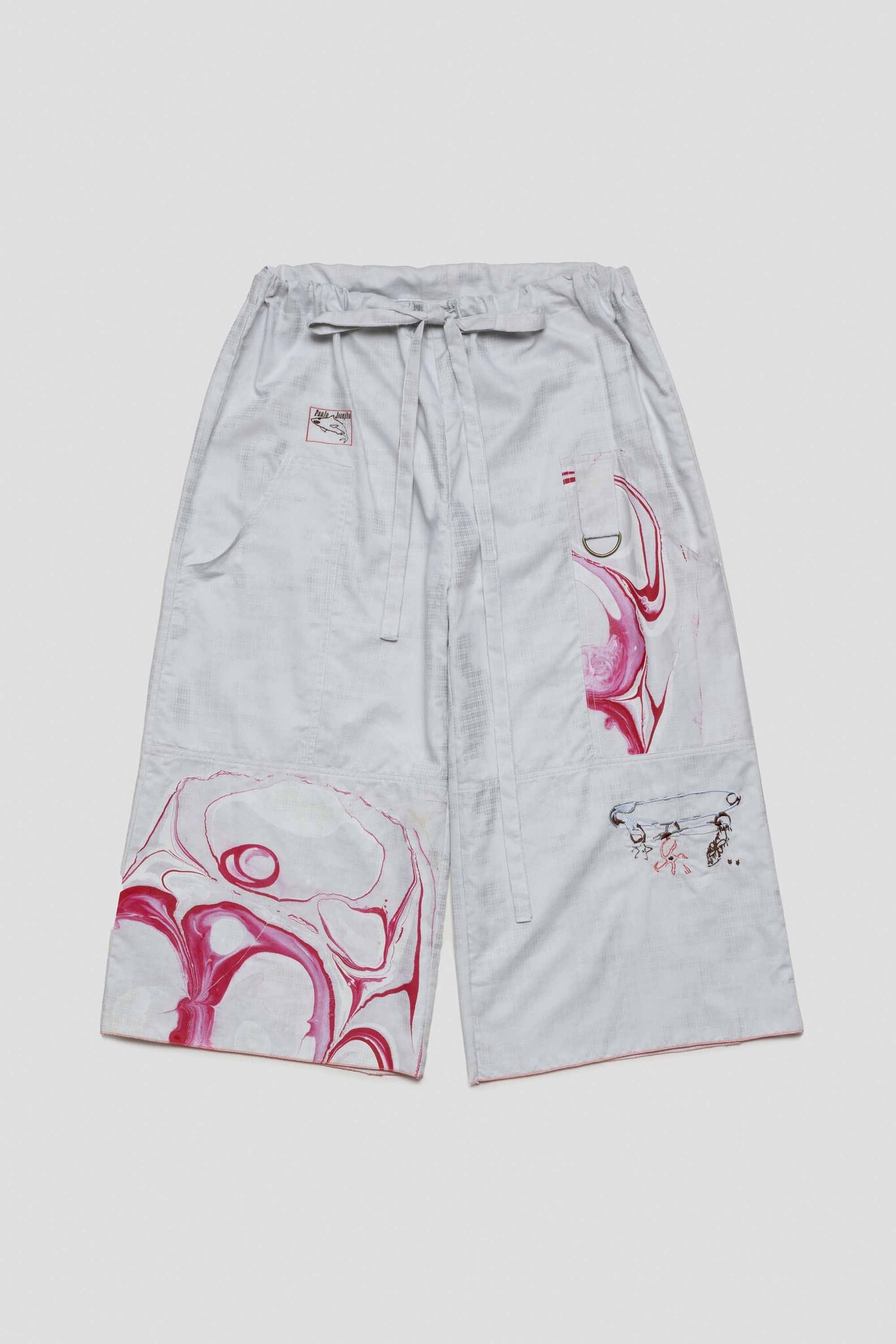 light blue shorts with marbled safety pin