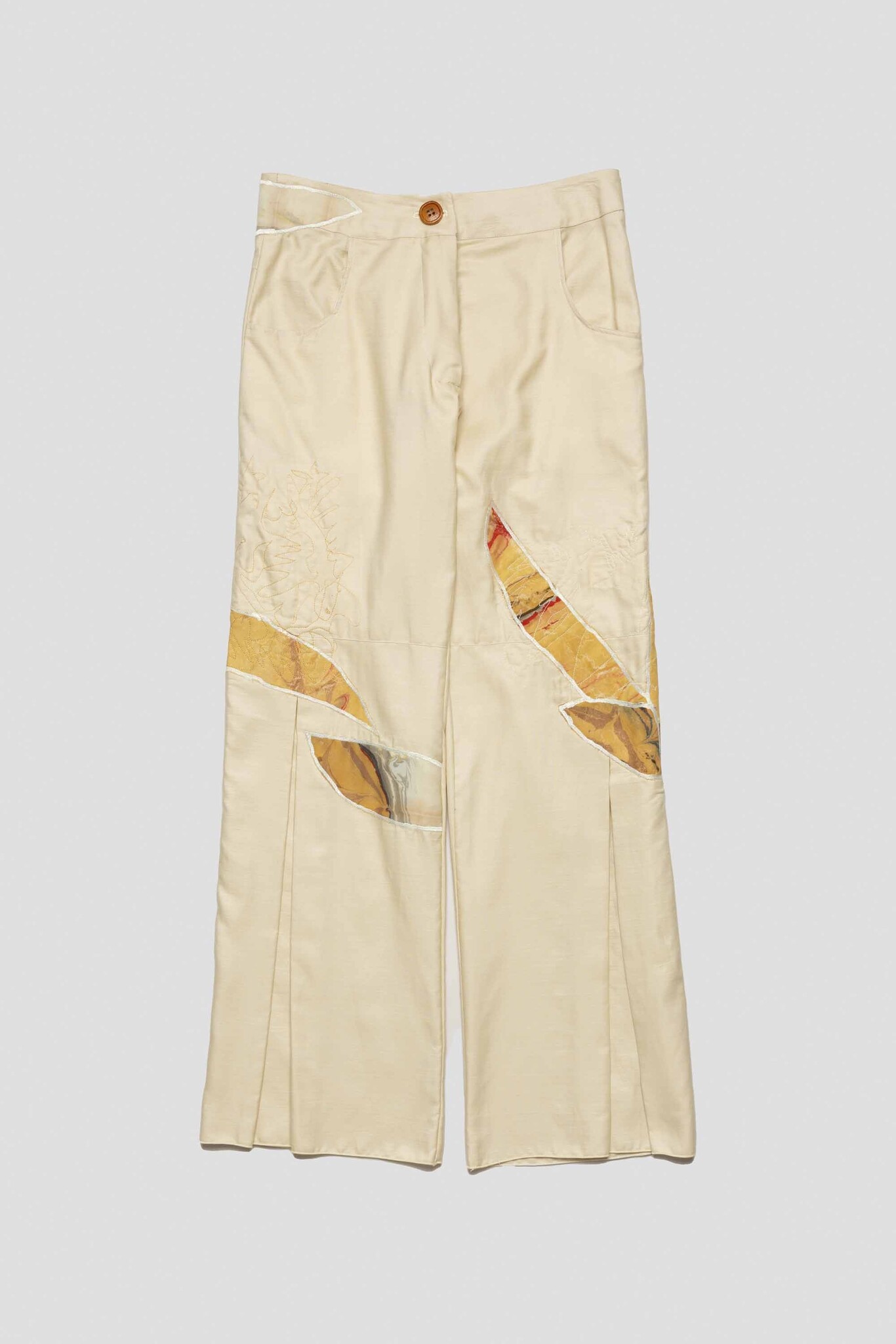 pale yellow trousers with feathers