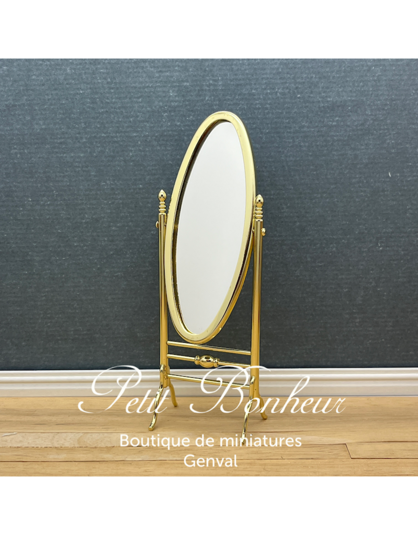 Miroir oval sur pieds doré