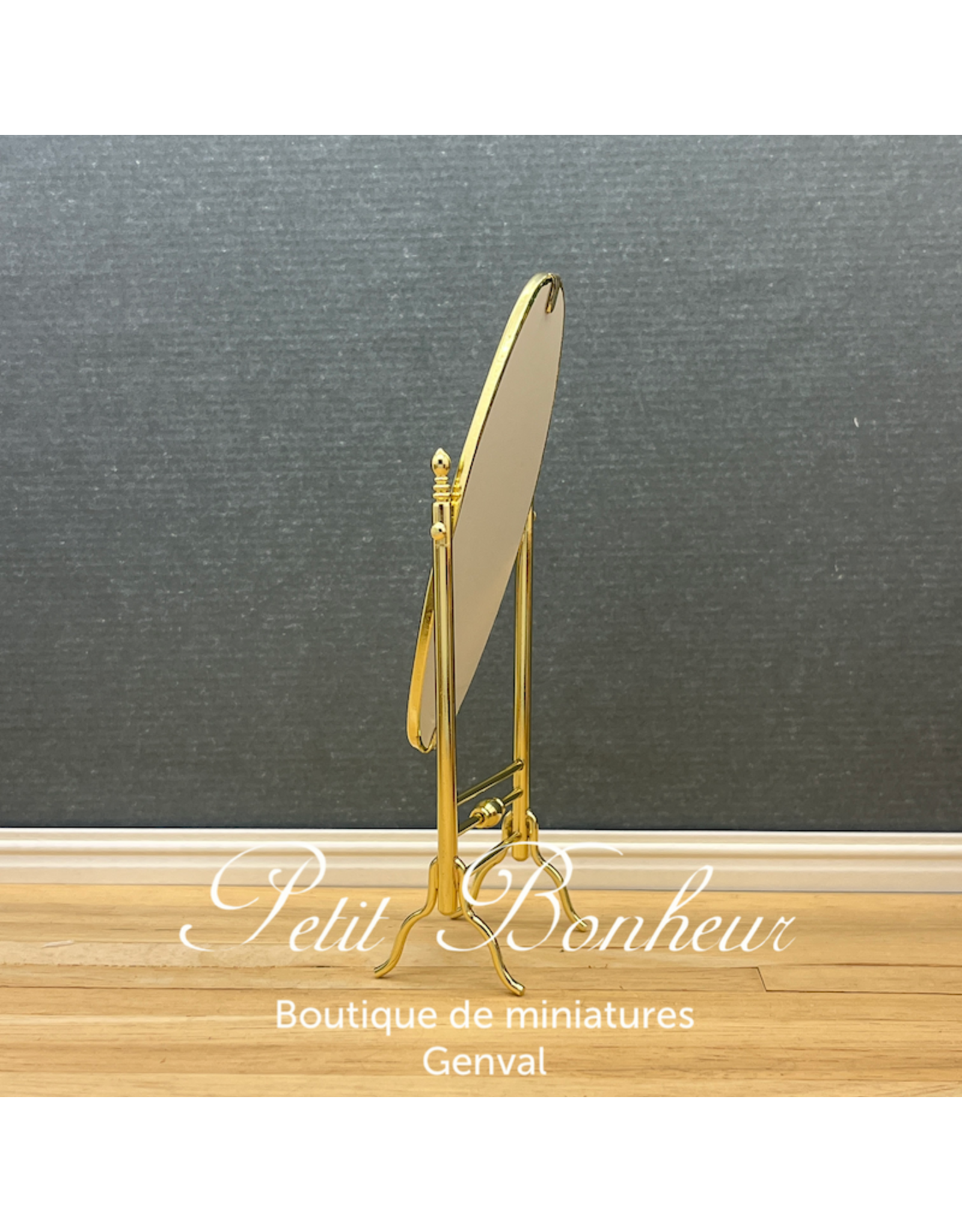 Miroir oval sur pieds doré