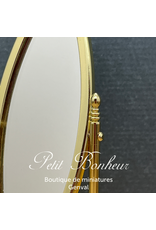 Miroir oval sur pieds doré