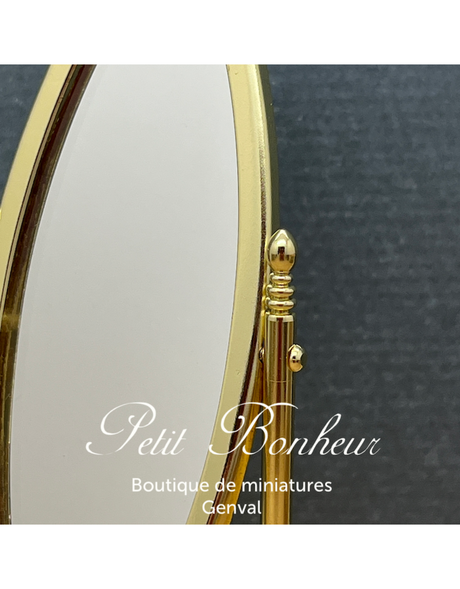 Miroir oval sur pieds doré