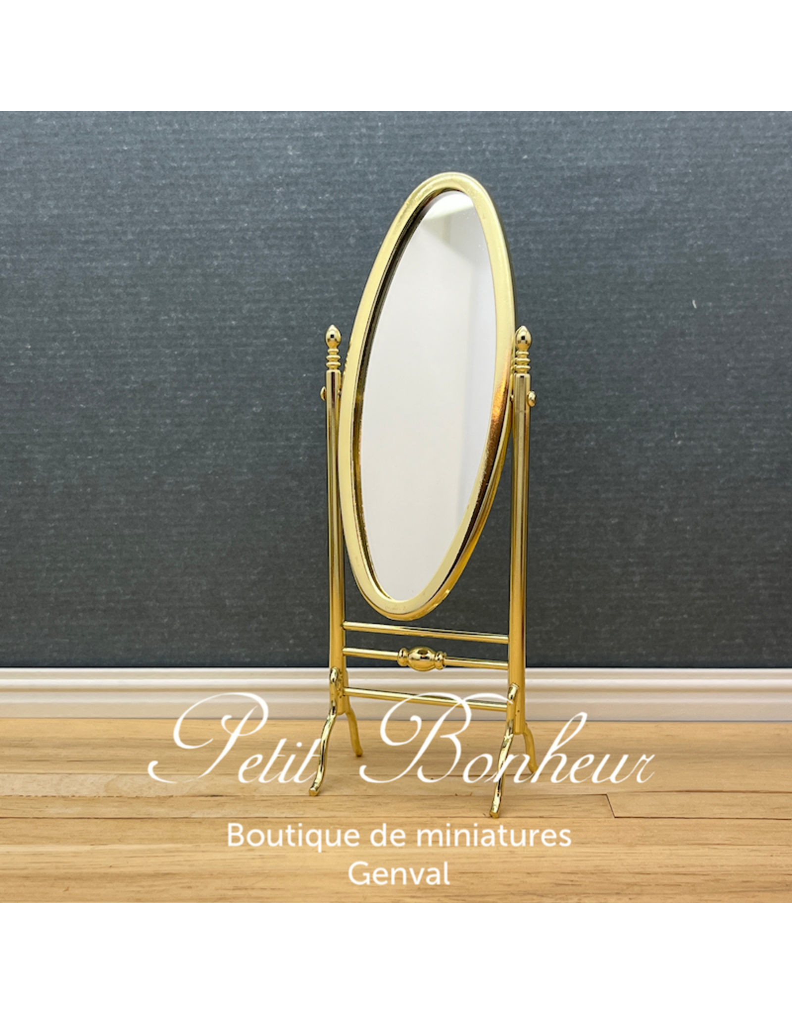 Miroir oval sur pieds doré