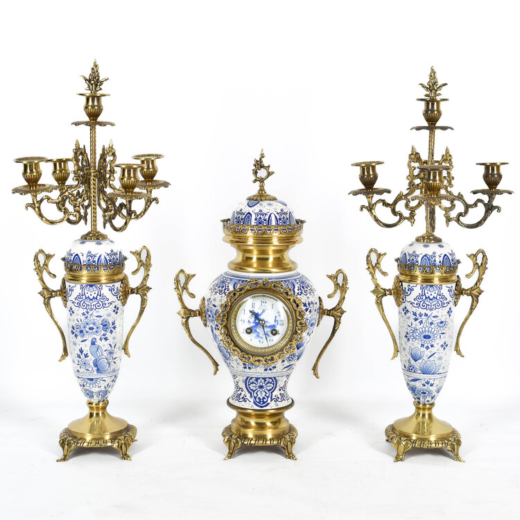 Delftsblauw Delftware three piece metal-mounted vases with clock and two candle holders