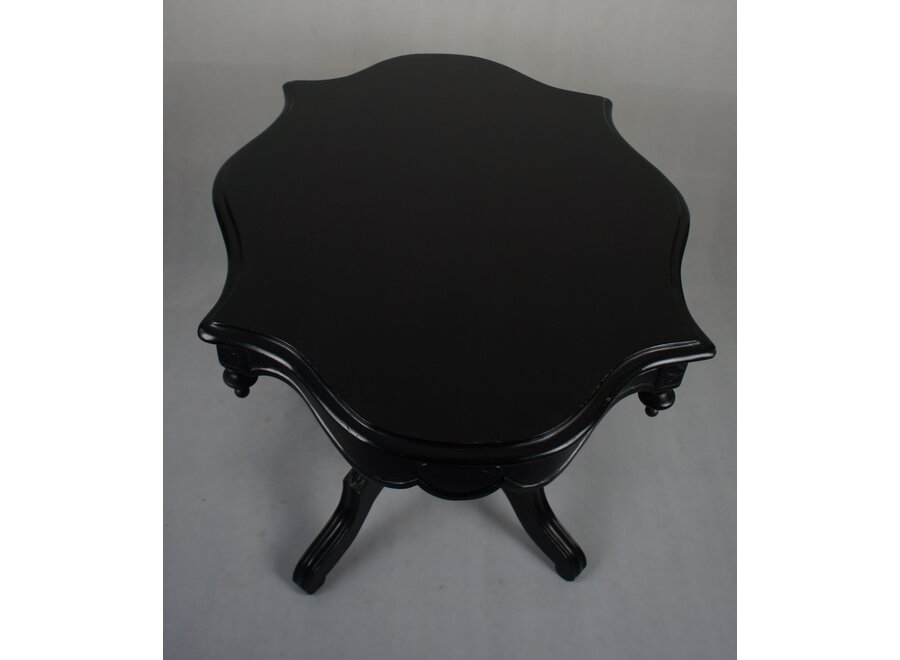 This romantic table was restored a few years ago and painted in black.