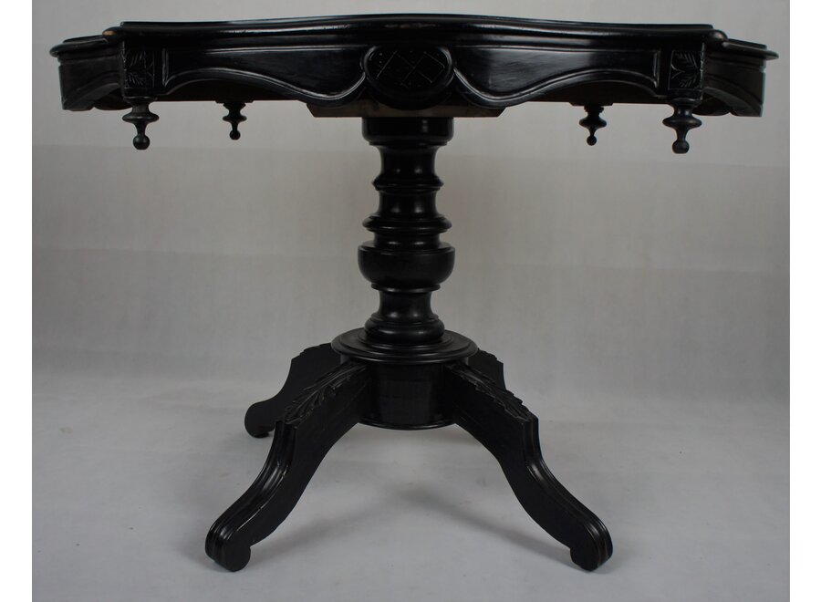 This romantic table was restored a few years ago and painted in black.