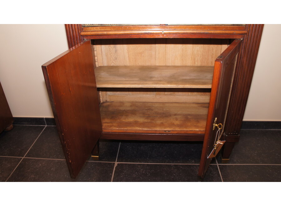 This cartonnière was finished in full wood and leather instead of cardboard