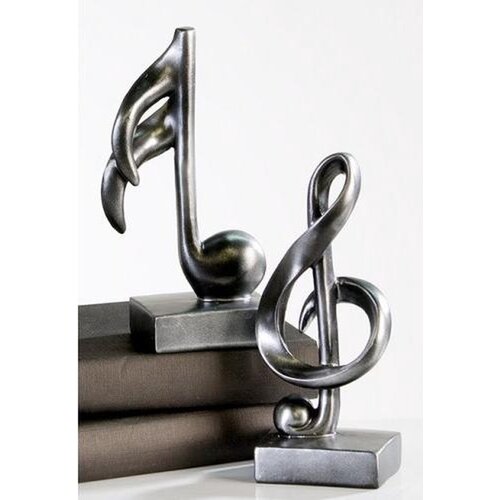Set van muzieknoot en muzieksleutel beeldjes Set van muzieknoot en muzieksleutel beeldjes