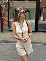 Beige gilet in linnen look en strikjes