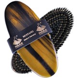 firmly brush Mustang for the coat of the horse