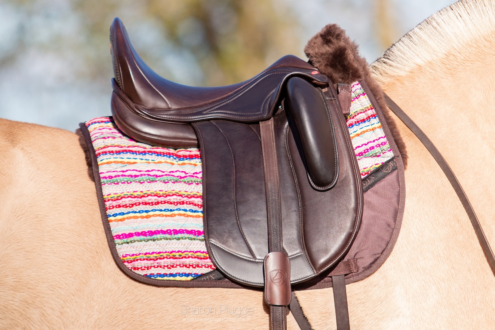 Brightstar dressuur pad met inlages lamsvel