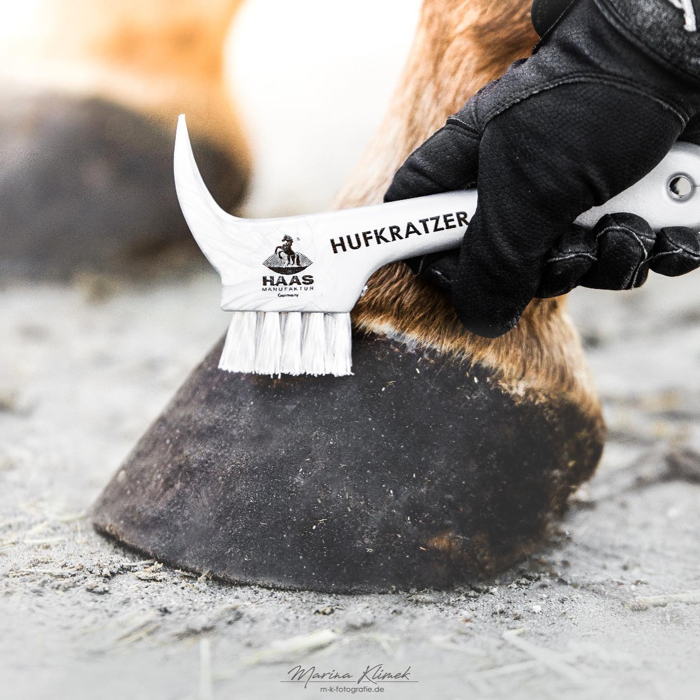 hoof pick with brush made from synthetic material