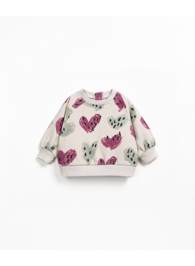 Play up printed fleece sweater tones