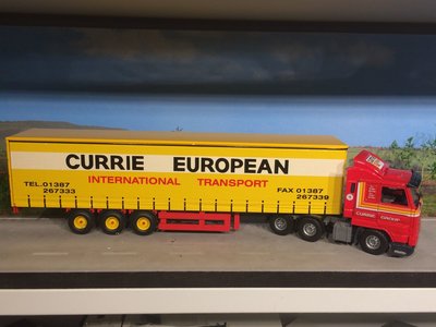 Tekno Tekno Scania 113M streamliner with tautliner semi trailer Currie European