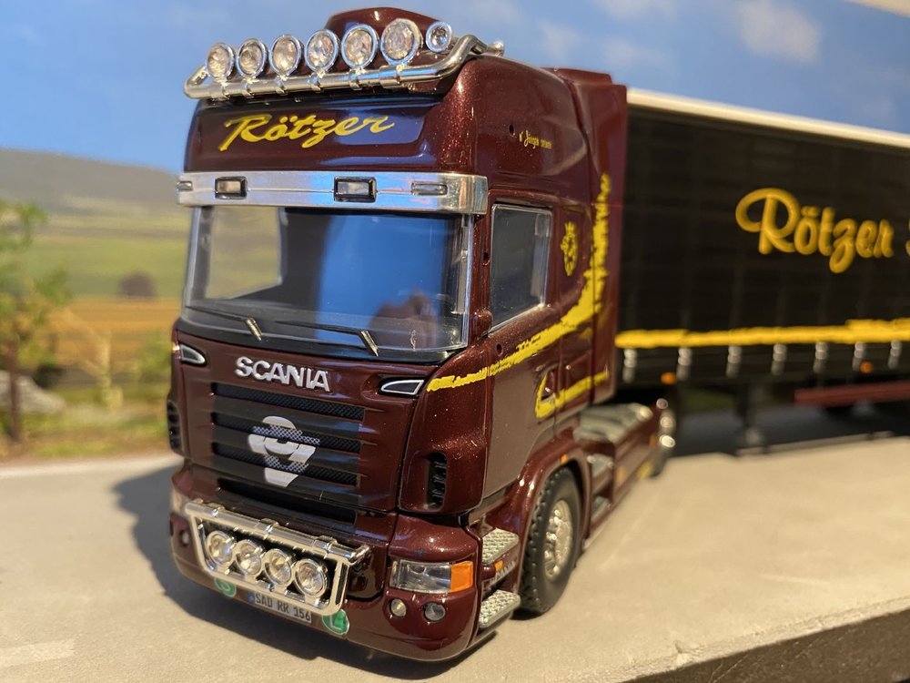 Tekno Tekno Scania R Topline met schuizeilen oplegger Rotzer