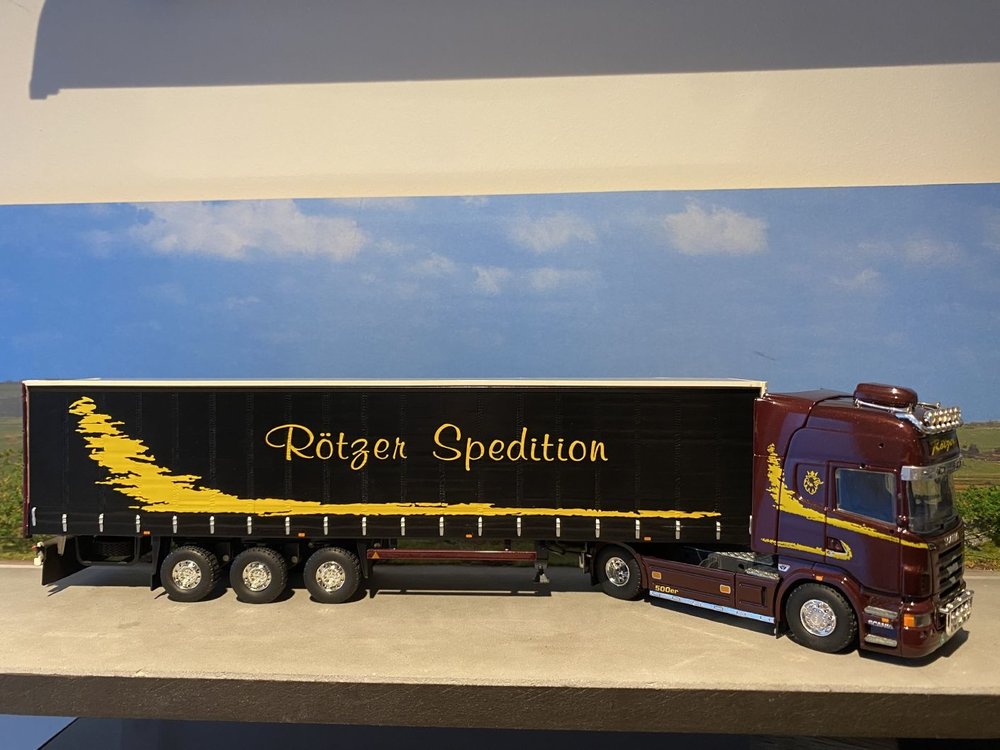 Tekno Tekno Scania R Topline met schuizeilen oplegger Rotzer