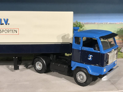 Tekno Tekno Volvo F88 with 2-axle classic curtain side trailer van Spronsen