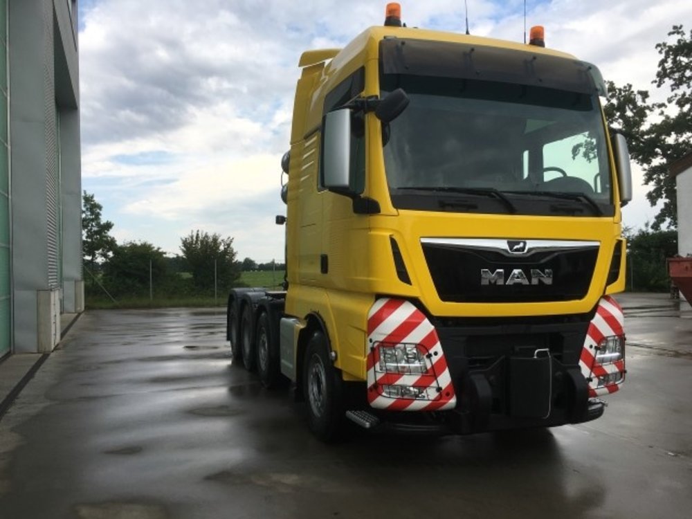 Tekno Tekno MAN TGX XXL 8x4 with 3-axle Goldhofer lowloader Welti Furrer