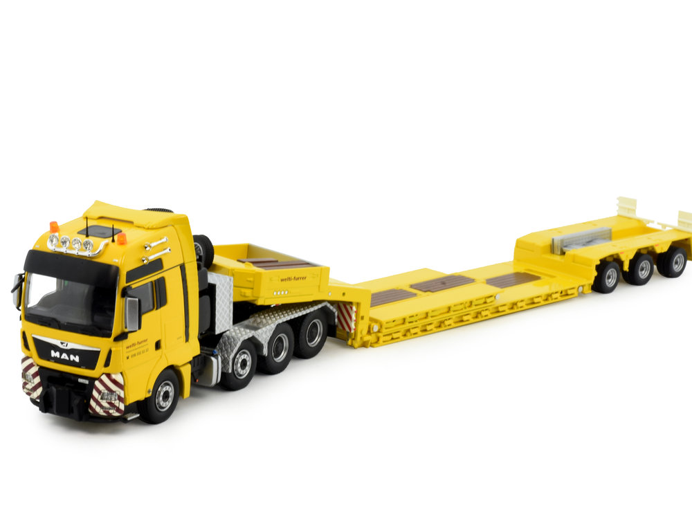 Tekno Tekno MAN TGX XXL 8x4 with 3-axle Goldhofer lowloader Welti Furrer