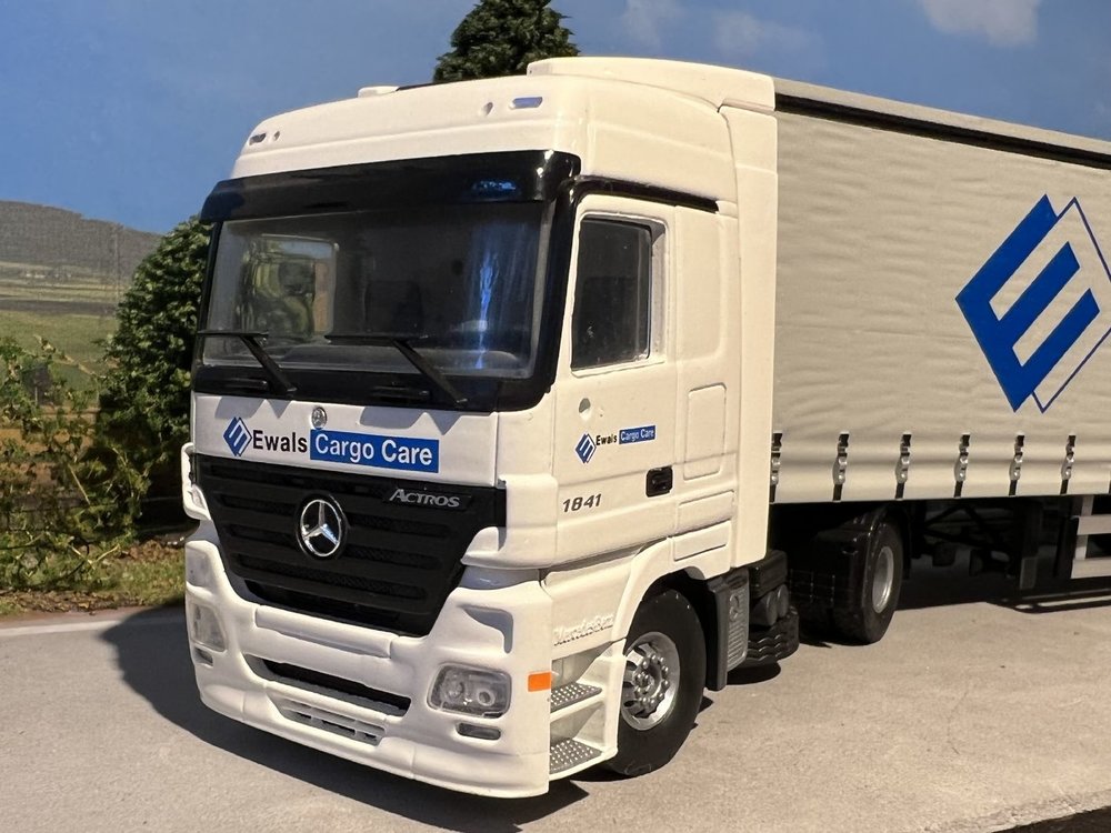 Tekno Tekno Mercedes Actros with 3-axle curtainside trailer Ewals Cargo Care