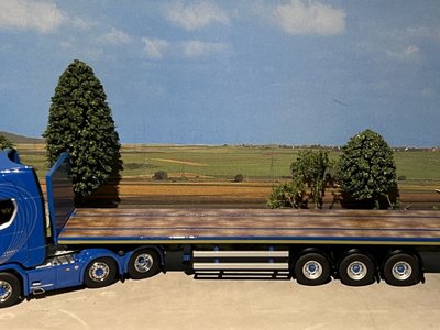 WSI IMC/Tekno  Scania S Highline 6x2 with 3-axle flatbed trailer Blue Crown