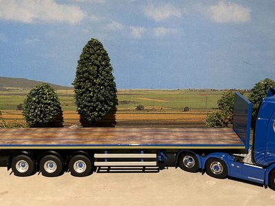 WSI IMC/Tekno  Scania S Highline 6x2 with 3-axle flatbed trailer Blue Crown