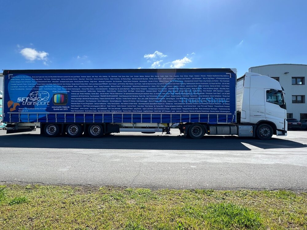 Tekno Tekno Volvo FH5 Globetrotter met schuifzeilentrailer MÜLLER SPENDENTRUCK