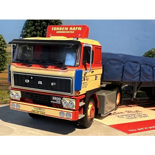 Tekno Tekno DAF 2800 with 3-axle classic flatbed trailer + covered load Torben Rafn