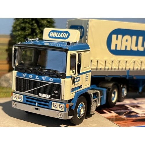 Tekno Tekno Volvo F12 6x2 with 2-axle classic curtain side trailer Hallens