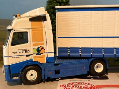 Tekno Tekno Volvo FH Glob. 4x2 with 3-axle curtainside trailer GEBR. VAN DE STEEG