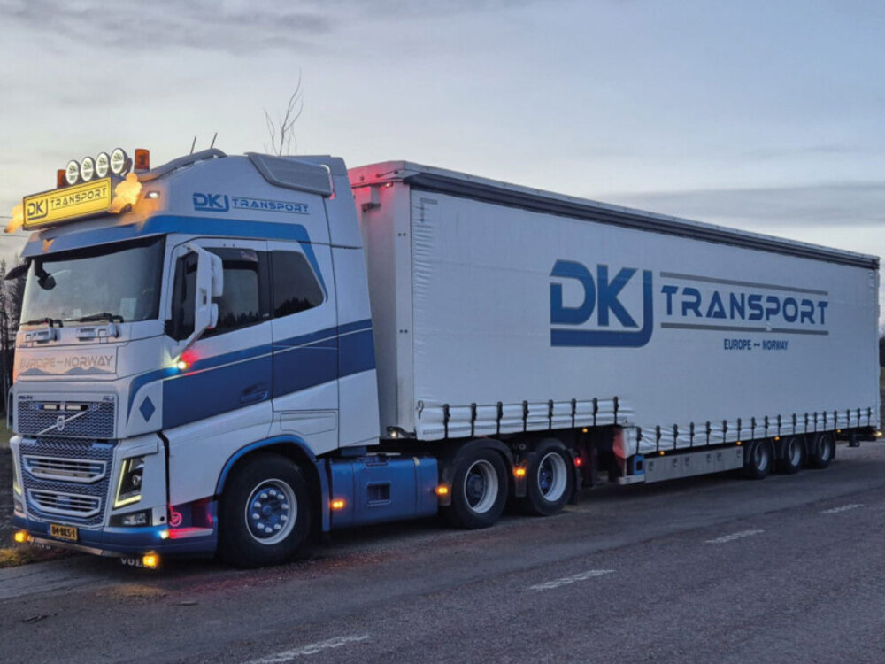 WSI WSI Volvo FH4 Glob. XL 6x2 with 3-axle semi with curtainside trailer DKJ TRANSPORT