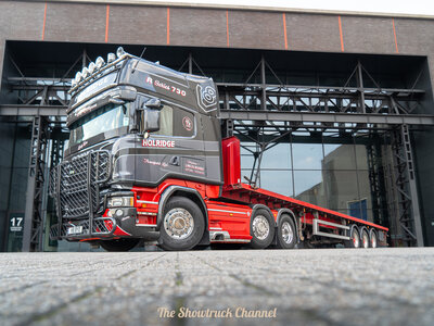 Tekno Tekno Scania R-serie Topline 6x2 met 3-assige vlakke trailer HOLRIDGE