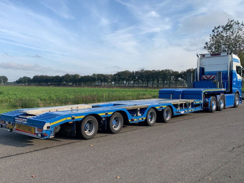 WSI WSI MAN TGX GX 6x2 witht 4-as semi wheel well low loader MANDERS DEURNE