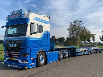 WSI WSI MAN TGX GX 6x2 witht 4-as semi wheel well low loader MANDERS DEURNE