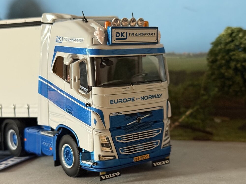 WSI WSI Volvo FH4 Glob. XL 6x2 with 3-axle semi with curtainside trailer DKJ TRANSPORT