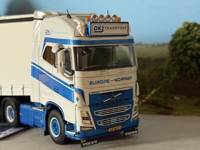 WSI WSI Volvo FH4 Glob. XL 6x2 with 3-axle semi with curtainside trailer DKJ TRANSPORT