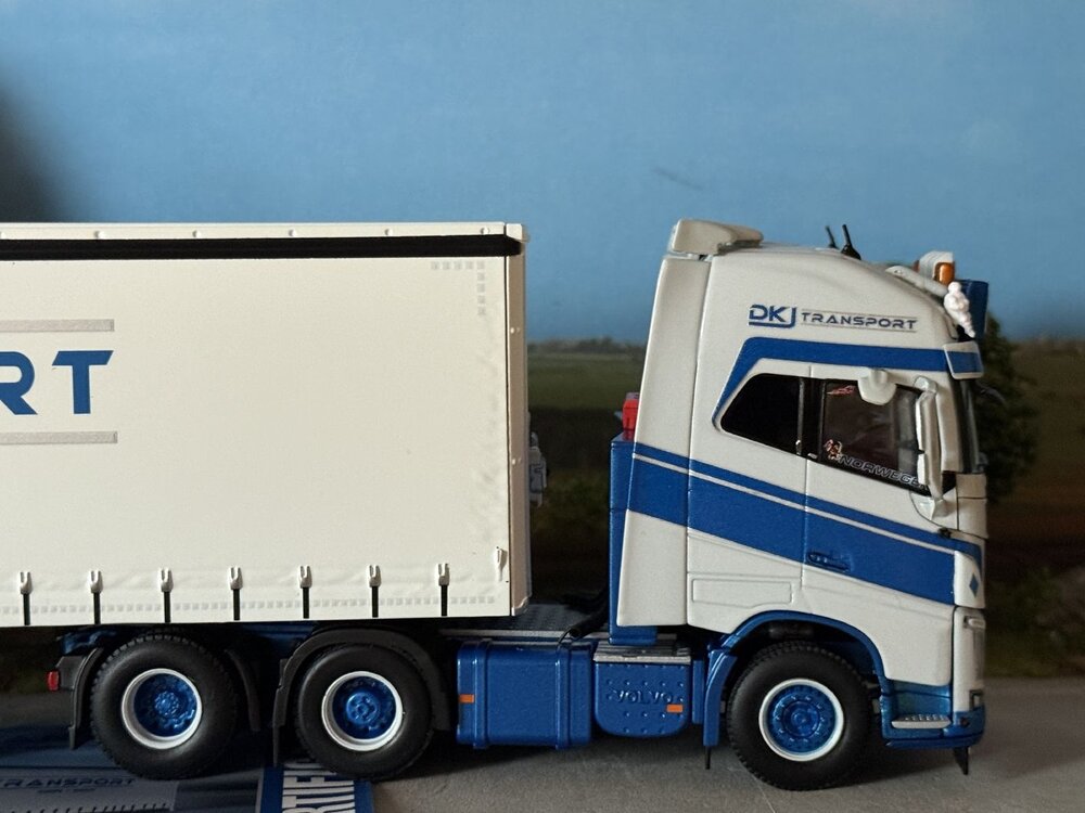 WSI WSI Volvo FH4 Glob. XL 6x2 with 3-axle semi with curtainside trailer DKJ TRANSPORT