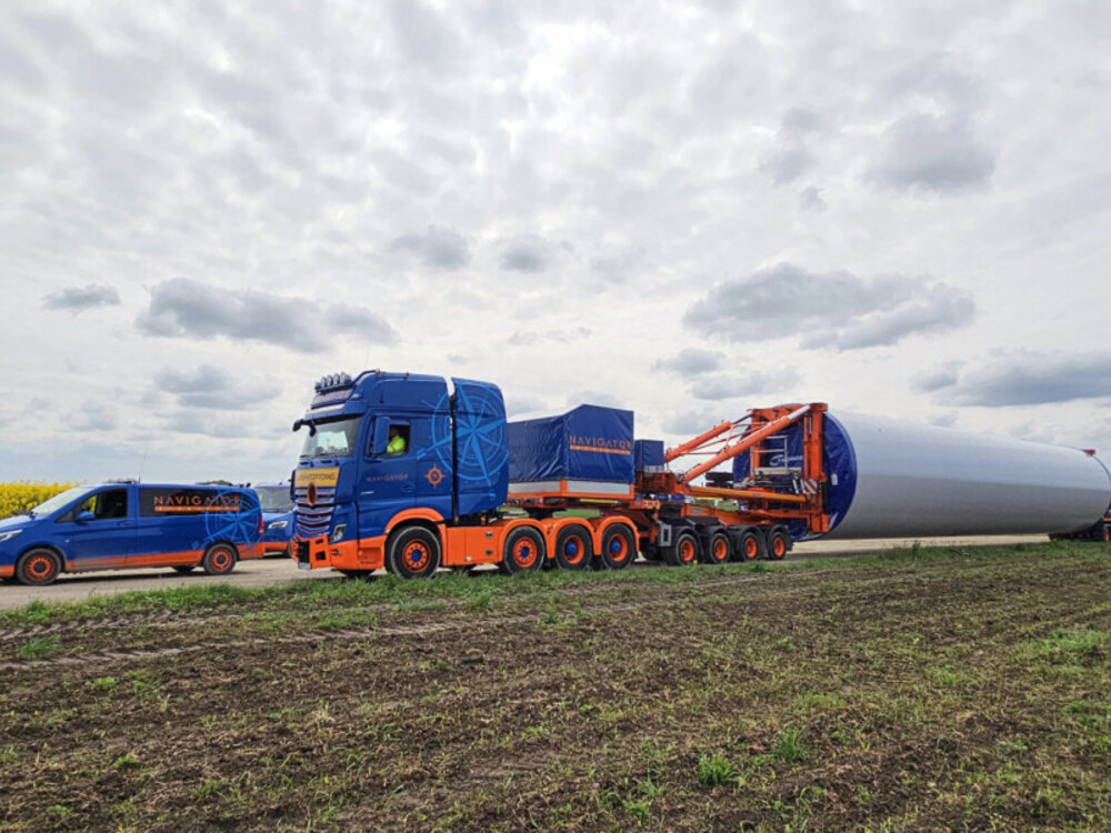 WSI WSI Mercedes-Benz Arocs MP5 Giga Space 8x4  with 7-axle wind mill trailer + 4-axle dolly NAVIGATOR TRANSPORT