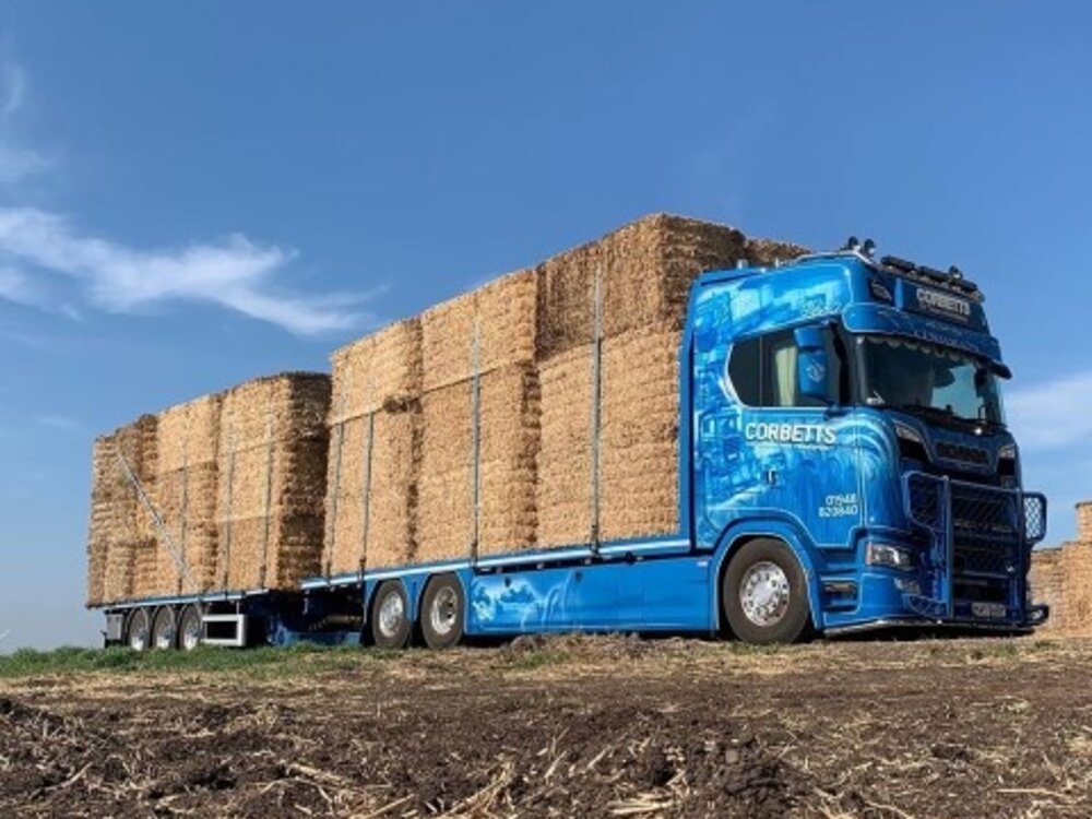 Tekno Tekno Scania Next Gen S650 Highline rigid truck with 3-axle flatbed trailer (incl. load) CORBETTS