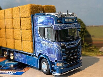 Tekno Tekno Scania Next Gen S650 Highline rigid truck with 3-axle flatbed trailer (incl. load) CORBETTS