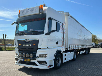 WSI WSI MAN TGX GX 4x2 with 3-axle curtainside trailer BREEDVELD TRANSPORT