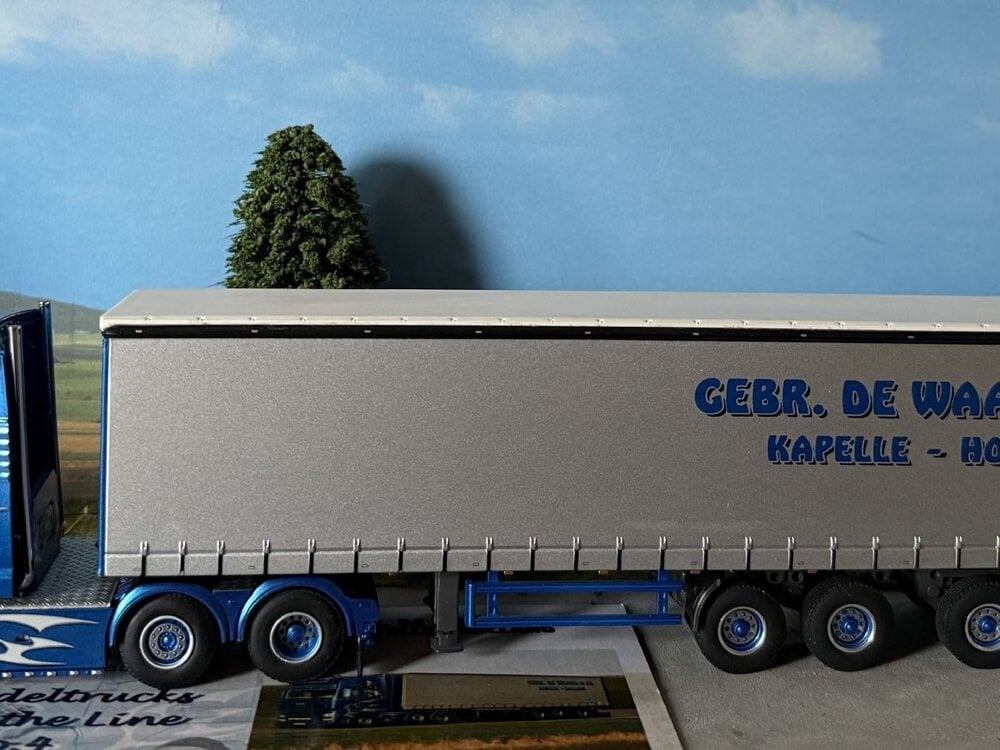 WSI WSI MAN TGX XXL 6X2 with 3-axle curtainside trailer MAURICE DE WAARD