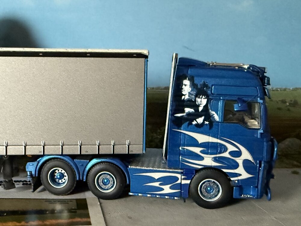 WSI WSI MAN TGX XXL 6X2 with 3-axle curtainside trailer MAURICE DE WAARD