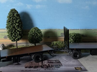 Tekno  Tekno Scania 111 rigid truck with 2-axle flatbed trailer PLOKKER PALLETS