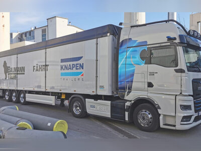 WSI WSI MAN TGX GX 4x2 with 3-axle moving floor trailer BAUMANN TRANS