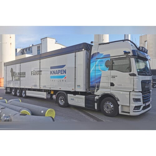 WSI WSI MAN TGX GX 4x2 met 3-as verschuifbare vloer trailer BAUMANN TRANS