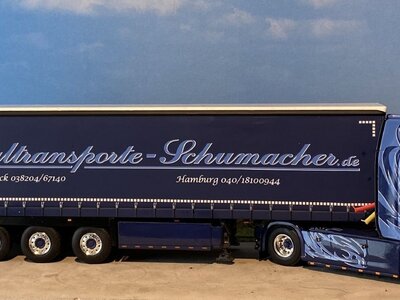 WSI WSI Scania NGS with 3-axle curtainside trailer SCHUMACHER