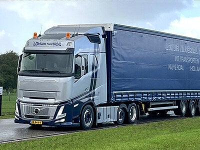 WSI WSI Volvo FH Aero Globetrotter 6x2 with 3-axle curtainside trailer LOHUIS NIJVERDAL