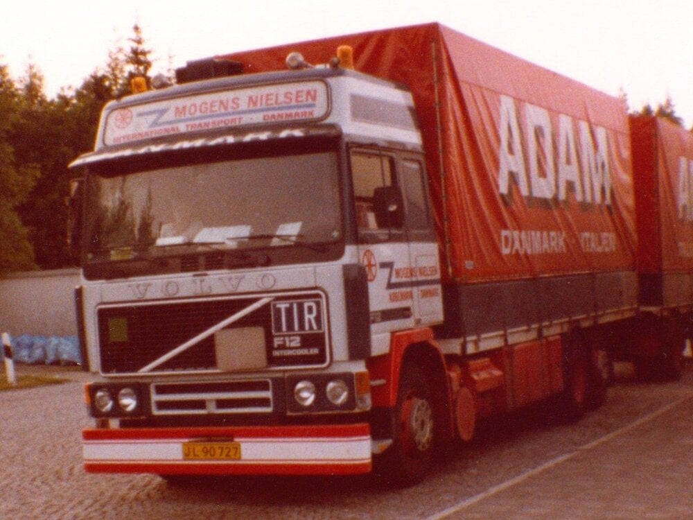 Tekno Tekno Volvo F12 Globetrotter riged truck with 2-axle tilt trailer MOGENS NIELSEN
