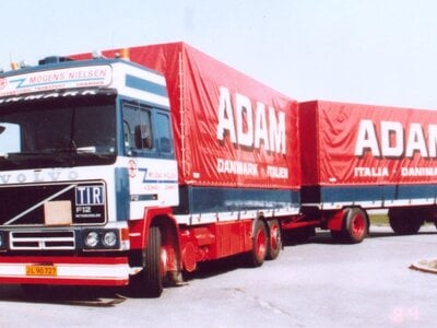 Tekno Tekno Volvo F12 Globetrotter riged truck with 2-axle tilt trailer MOGENS NIELSEN